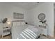 Bright bedroom with light hardwood floors and a ceiling fan at 1074 Signet Dr, Apollo Beach, FL 33572