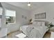 Comfortable bedroom with bright sunlight featuring a large window with backyard scenery at 1074 Signet Dr, Apollo Beach, FL 33572
