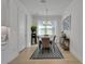 Dining room with hardwood floors and views of the kitchen at 1074 Signet Dr, Apollo Beach, FL 33572