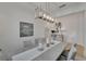 Beautiful dining room with modern chandelier, decor and neutral colors, perfect for Gathering meals at 1074 Signet Dr, Apollo Beach, FL 33572