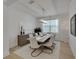 Elegant dining room with a large table, modern chandelier, and stylish decor at 1074 Signet Dr, Apollo Beach, FL 33572