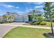 Beautiful home with well-manicured lawn, landscaping, and three car garage at 1074 Signet Dr, Apollo Beach, FL 33572