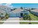 Attractive single-Gathering home featuring a brick driveway and well-maintained landscaping at 1074 Signet Dr, Apollo Beach, FL 33572