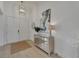 Bright foyer featuring double doors, modern lighting, mirror, and stylish console table at 1074 Signet Dr, Apollo Beach, FL 33572