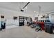 Spacious garage with epoxy flooring, storage racks, and room for multiple vehicles at 1074 Signet Dr, Apollo Beach, FL 33572