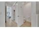 Hallway leading to the main bedroom features a closet and a powder room at 1074 Signet Dr, Apollo Beach, FL 33572