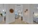 Hallway with wood-look flooring and neutral paint leads into living areas and bedroom at 1074 Signet Dr, Apollo Beach, FL 33572