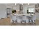 Open kitchen with a large island, pendant lighting, and stainless steel appliances at 1074 Signet Dr, Apollo Beach, FL 33572