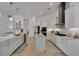 Bright kitchen boasts white cabinets, a center island, and stainless steel appliances at 1074 Signet Dr, Apollo Beach, FL 33572