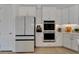 Bright kitchen with stainless steel oven, refrigerator, and lots of cabinet space at 1074 Signet Dr, Apollo Beach, FL 33572