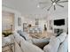 Open concept living room with island seating and pendant lights that connects to the kitchen at 1074 Signet Dr, Apollo Beach, FL 33572