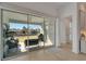 Living space with sliding glass doors leading to an outdoor patio with lake views at 1074 Signet Dr, Apollo Beach, FL 33572