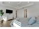Comfortable main bedroom with decorative tray ceiling and ensuite bathroom access at 1074 Signet Dr, Apollo Beach, FL 33572