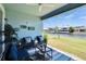 Relaxing covered patio with outdoor seating and scenic waterfront views at 1074 Signet Dr, Apollo Beach, FL 33572