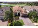 Beautiful aerial view of home with lush landscaping and golf course at 13118 Sorrento Way, Bradenton, FL 34211