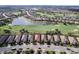 Aerial view of home surrounded by golf course and pond at 13118 Sorrento Way, Bradenton, FL 34211