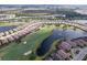 Aerial view of home and community near golf course and lake at 13118 Sorrento Way, Bradenton, FL 34211