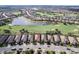 Golf course community aerial view, with luxury homes, a lake, and a pristine golf course at 13118 Sorrento Way, Bradenton, FL 34211