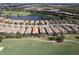 Aerial view of community with golf course and lake at 13118 Sorrento Way, Bradenton, FL 34211