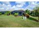 Backyard oasis with a large pool, lush landscaping, and screened enclosure at 13118 Sorrento Way, Bradenton, FL 34211