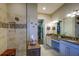 Elegant bathroom with double vanity, large shower, and walk-in closet at 13118 Sorrento Way, Bradenton, FL 34211