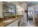 Bathroom with double vanity and granite countertop at 13118 Sorrento Way, Bradenton, FL 34211