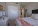 Bright bedroom with a queen-size bed and private access at 13118 Sorrento Way, Bradenton, FL 34211