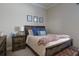 Bedroom with wooden bed frame and neutral color scheme at 13118 Sorrento Way, Bradenton, FL 34211