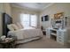 Charming bedroom with a queen-size bed and vanity at 13118 Sorrento Way, Bradenton, FL 34211