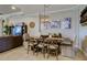 Rustic dining room with wooden table and statement chandelier at 13118 Sorrento Way, Bradenton, FL 34211