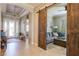 Bright entry with tile flooring, barn door, and views to living areas at 13118 Sorrento Way, Bradenton, FL 34211