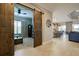 Spacious entry with barn doors leading to the living room and kitchen at 13118 Sorrento Way, Bradenton, FL 34211