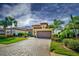 Single story home with tile roof and paver driveway, nicely landscaped at 13118 Sorrento Way, Bradenton, FL 34211