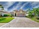 Single-story home with tile roof, paver driveway, and nicely landscaped yard at 13118 Sorrento Way, Bradenton, FL 34211