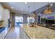 Open kitchen with granite island, stainless steel appliances, and views to Gathering room at 13118 Sorrento Way, Bradenton, FL 34211