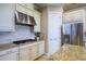 Well-equipped kitchen with granite countertops, gas cooktop, and ample cabinetry at 13118 Sorrento Way, Bradenton, FL 34211