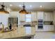 Modern kitchen with granite countertops, farmhouse sink, and stainless steel appliances at 13118 Sorrento Way, Bradenton, FL 34211