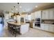 Gourmet kitchen features granite countertops, custom cabinetry, and stainless steel appliances at 13118 Sorrento Way, Bradenton, FL 34211