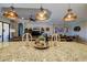 Gourmet kitchen island with granite countertops and stylish light fixtures at 13118 Sorrento Way, Bradenton, FL 34211