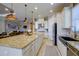 Large kitchen island with granite countertops is perfect for casual dining and entertaining at 13118 Sorrento Way, Bradenton, FL 34211