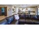 Open floor plan boasts a spacious kitchen with island and stainless steel appliances, adjacent to a cozy living room at 13118 Sorrento Way, Bradenton, FL 34211