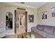 Open living room with a view down a hallway and barn door at 13118 Sorrento Way, Bradenton, FL 34211