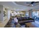 Open concept living room with a view of the kitchen and patio at 13118 Sorrento Way, Bradenton, FL 34211