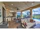 Outdoor kitchen with built-in grill, sink, and string lights at 13118 Sorrento Way, Bradenton, FL 34211