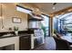 Outdoor kitchen with stainless steel appliances and granite countertop at 13118 Sorrento Way, Bradenton, FL 34211