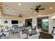 Relaxing outdoor patio with seating area, string lights, and access to the interior at 13118 Sorrento Way, Bradenton, FL 34211