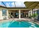 Enjoy this relaxing pool area with covered patio and outdoor kitchen at 13118 Sorrento Way, Bradenton, FL 34211