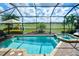 Inviting screened pool and spa with a beautiful view of the golf course at 13118 Sorrento Way, Bradenton, FL 34211