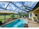 Enjoy this luxurious pool and spa area with a covered patio and golf course views at 13118 Sorrento Way, Bradenton, FL 34211