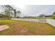 Landscaped backyard with white picket fence at 16402 Lake Heather Dr, Tampa, FL 33618